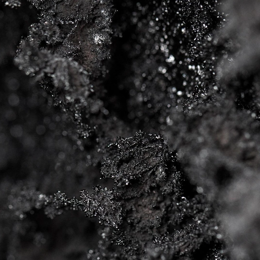 Retained-carbon material